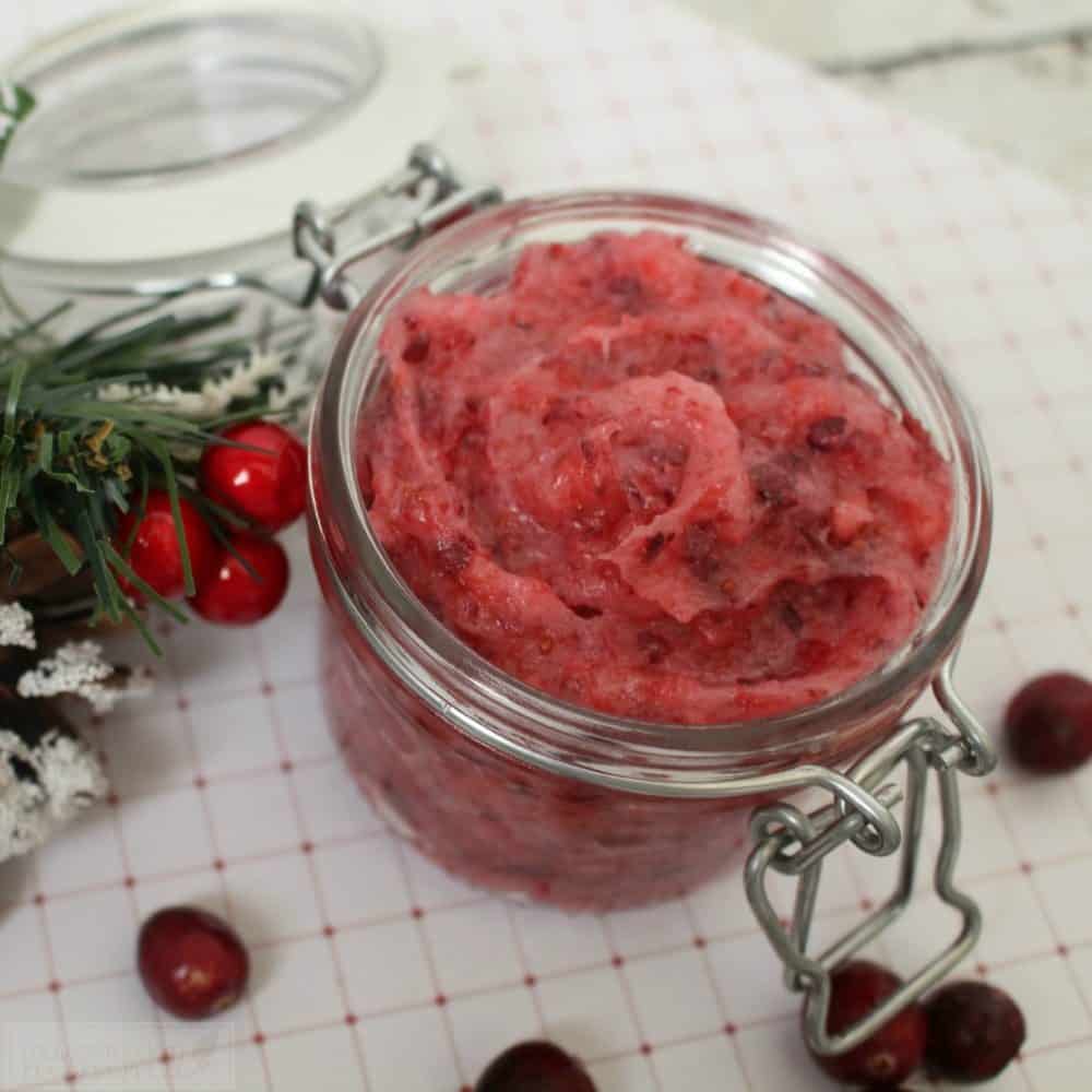 Homemade Sugar Scrub featuring cranberry and vitamin E oil for moisturizing and exfoliation is a great gift this holiday season. Make this and put under the tree for your friends and family!